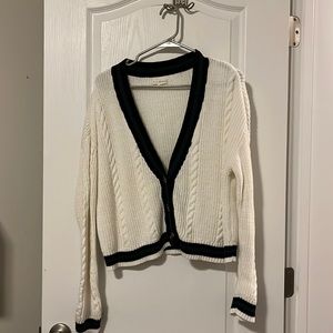 White cardigan with navy and green. Looks great with black or green top